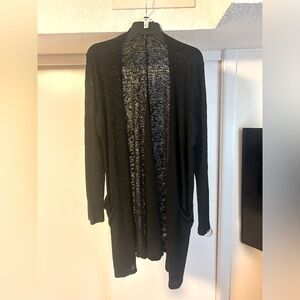 Simple, thin oversized black cardigan with pockets.